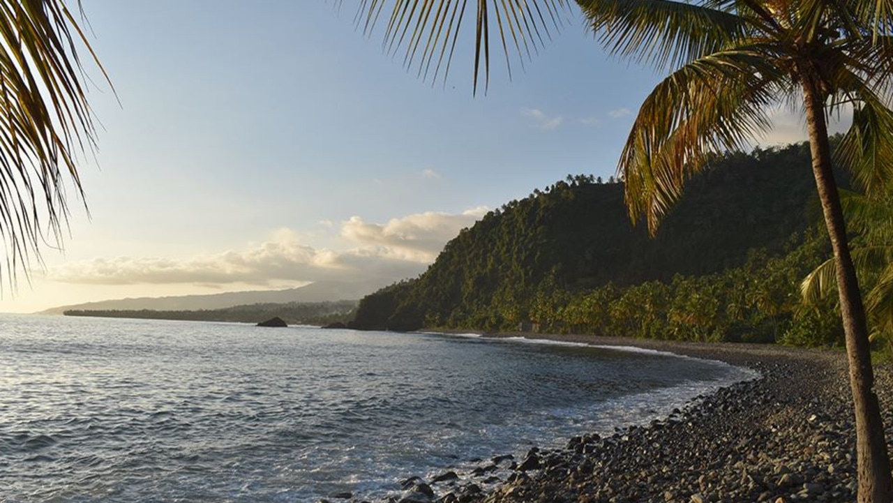 The rest of the island, halfway between the African coast and Madagascar, is covered with dark basalt from a volcano. Picture: Kevin Krajick/Earth Institute