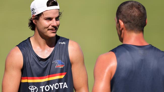 Darcy Fogarty talks with Taylor Walker at a summer session.