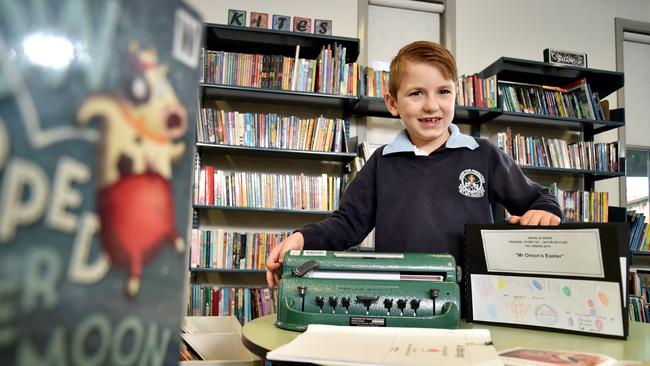 Jacob Butler uses a braille typewriter his Meadowbank school. Picture: Troy Snook