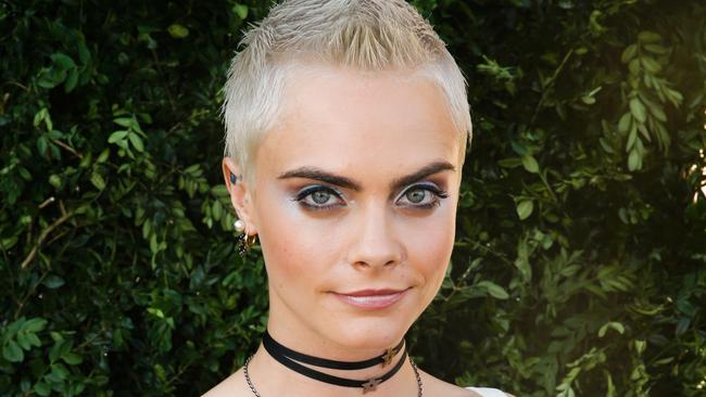 Cara Delevingne has recently chopped her hair and says she feels liberated because she can no longer hide behind it. Picture: GEOFFROY VAN DER HASSELT / AFP