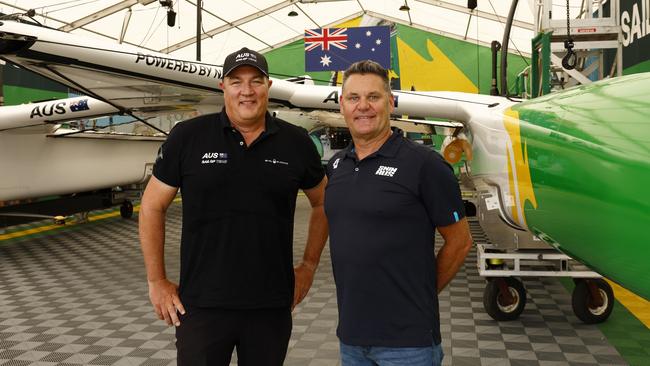 Swimming Australia's head coach Rohan Taylor (right) and Australian SailGP coach Ben Durham with their boat at their base in Rozelle. Picture: Jonathan Ng