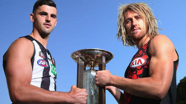 Scott Pendlebury of the Magpies (L) and Dyson Heppell of the Bombers pose for photos.