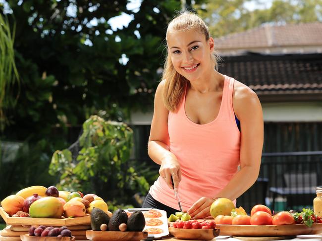 Carolena Kostas, 19, is about to start her second year of university and to save money she lives at home with her parents. She cooks and eats her own meals at home to save money. Picture: Craig Greenhill