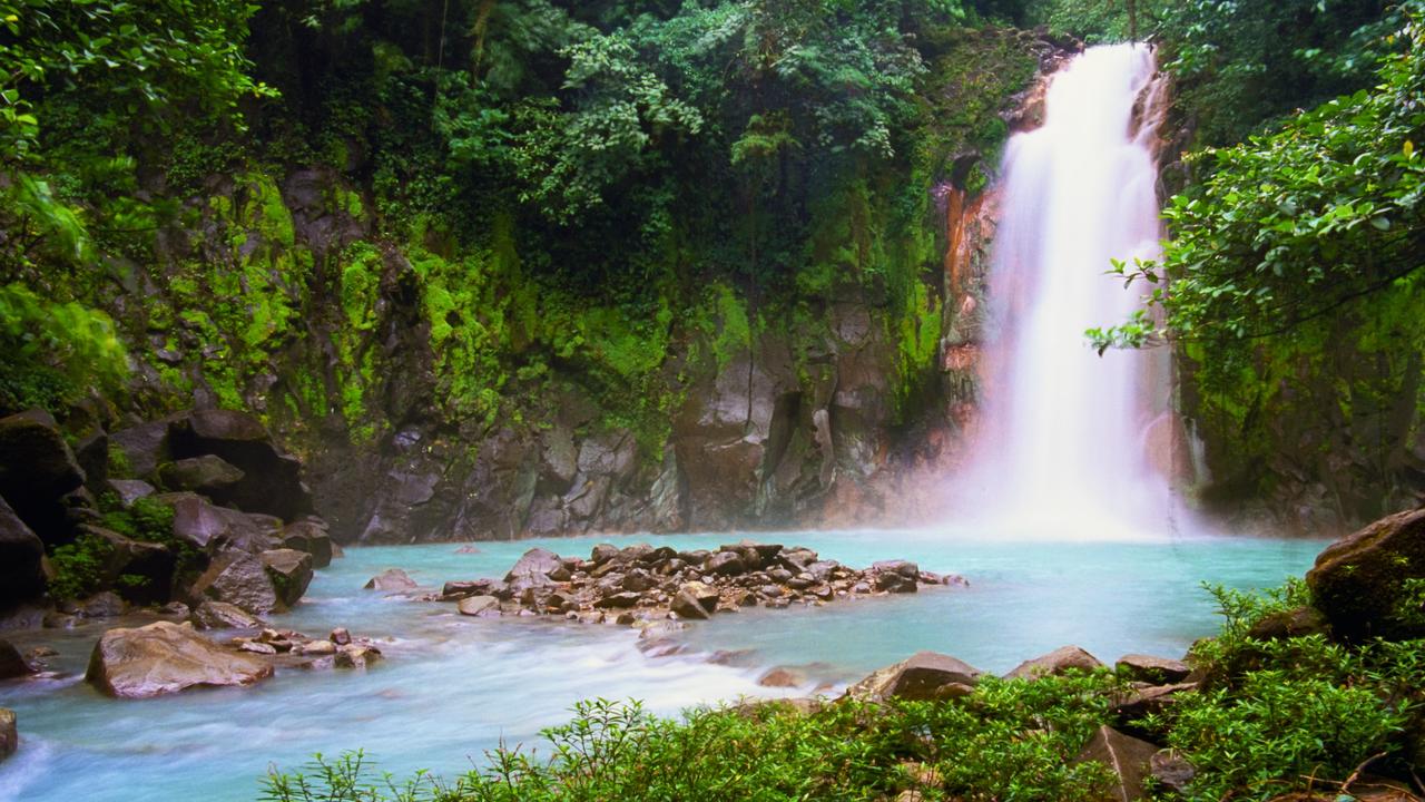 Celeste Falls, with their sky-blue water, in the rainforest of Costa Rica.