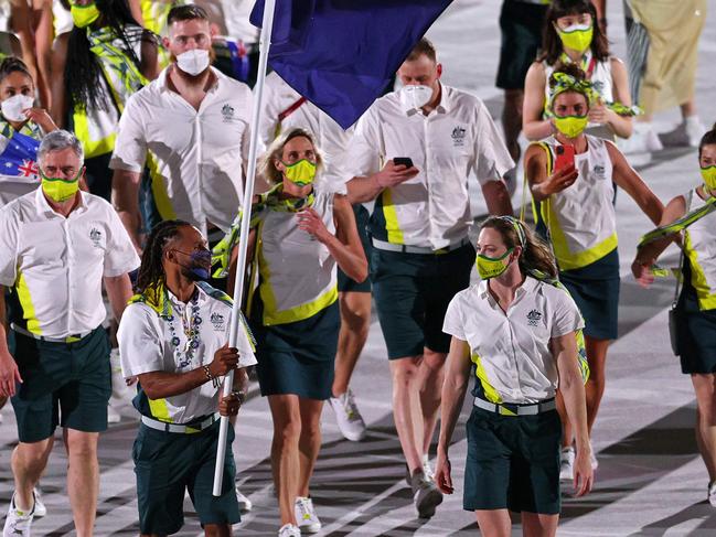 TOKYO, JAPAN - JULY 23: Flag bearers Cate Campbell and Patty Mills of Team Australia lead their team during the Opening Ceremony of the Tokyo 2020 Olympic Games at Olympic Stadium on July 23, 2021 in Tokyo, Japan. (Photo by Patrick Smith/Getty Images)