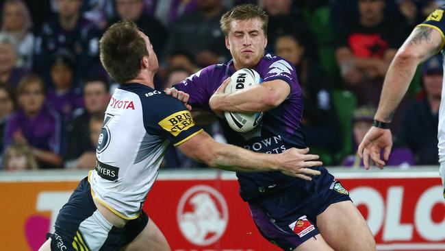 Cameron Munster is tackled by Michael Morgan.