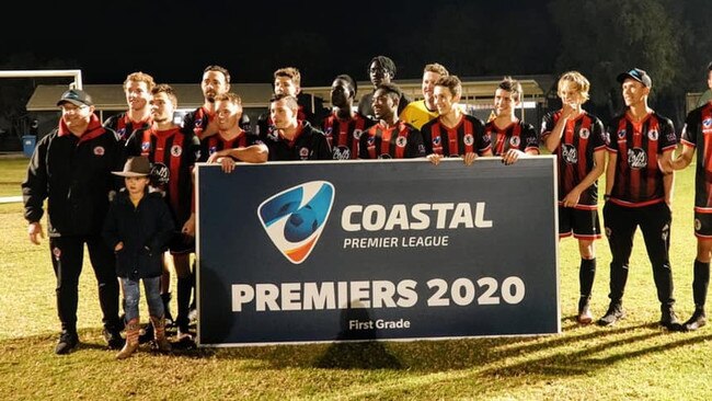 The Coffs City United Lions are presented with the inaugural Coastal Premier League trophy after finishing top of the table. Photo: Coastal Premier League