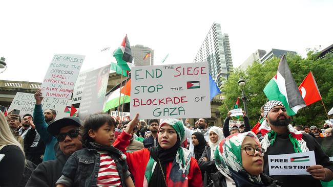 Pro Palestinian supporters are seen rallying outside the Melbourne State Library. Picture: NCA NewsWire / Luis Enrique Ascui