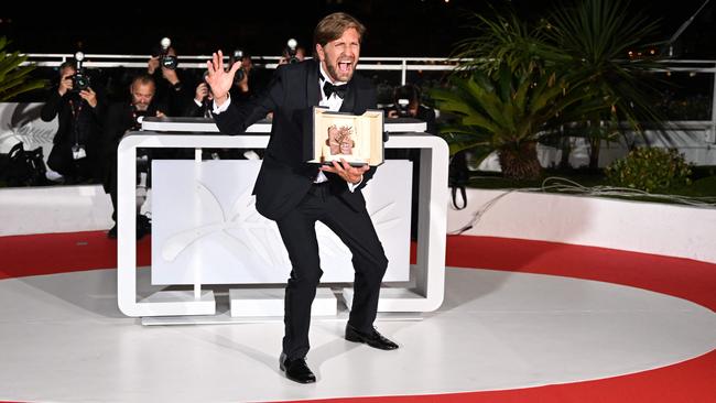 Ruben Ostlund celebrates his second Palme d’Or at Cannes on Saturday night. Picture: AFP