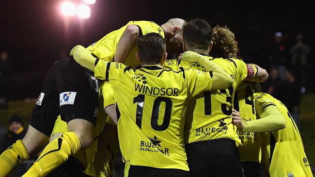 Heidelberg United celebrate a goal by Ken Athiu.