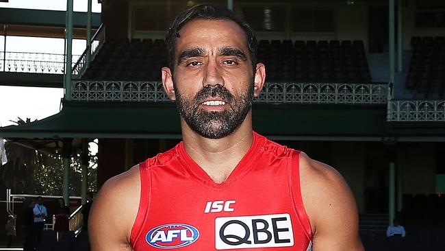 SYDNEY, AUSTRALIA - MAY 22: Adam Goodes, wearing the Sydney Swans Indigenous Round guernsey designed by his mum Lisa Sansbury, poses following a Sydney Swans AFL press conference ahead of next weekends AFL Indigenous round at Sydney Cricket Ground on May 22, 2014 in Sydney, Australia. (Photo by Brendon Thorne/Getty Images)