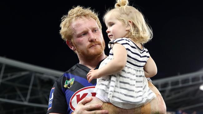 James Graham of the Bulldogs walks with his daughter.