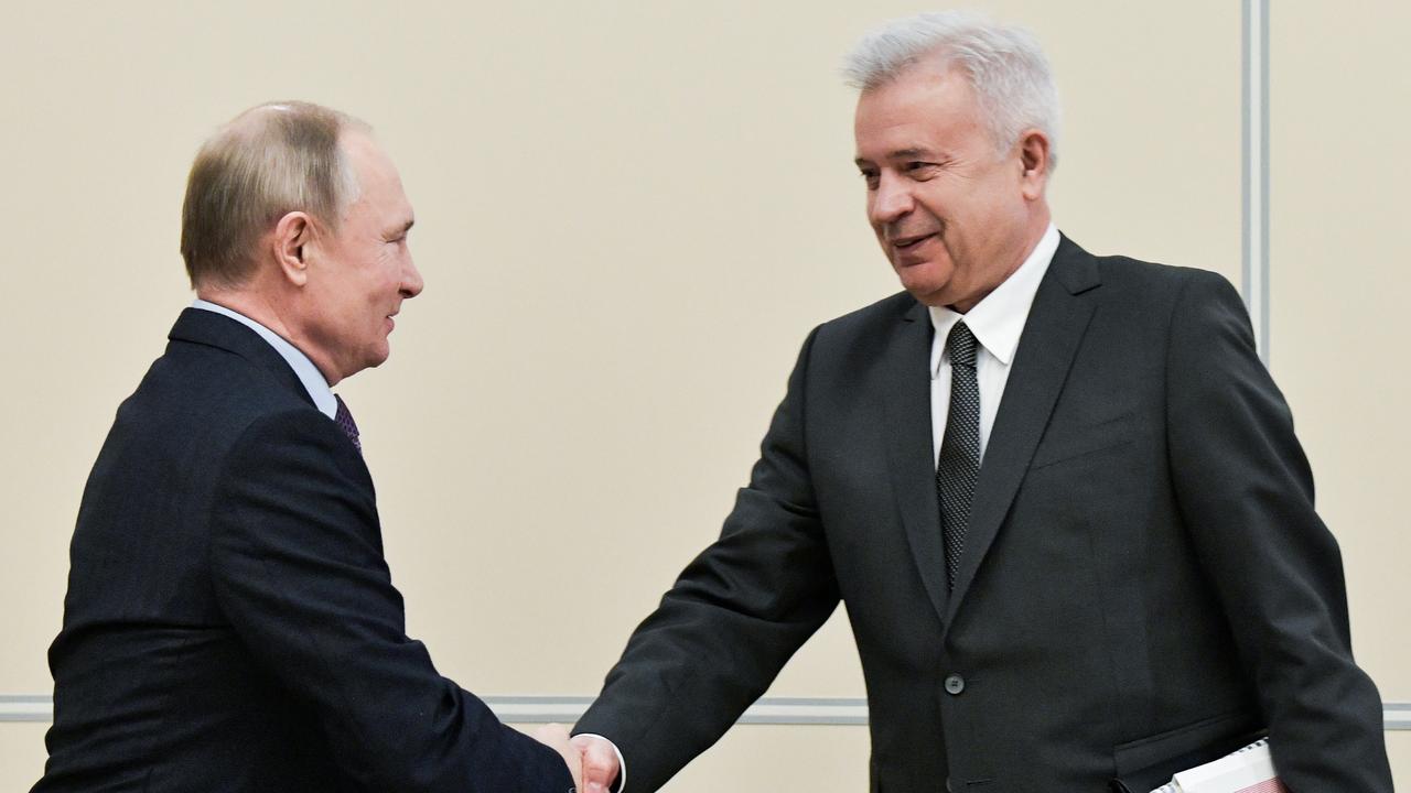 Russia's President Vladimir Putin and Lukoil President Vagit Alekperov shake hands during a meeting at the Novo-Ogaryovo residence in 2020. (Photo by Alexei Nikolsky\\TASS via Getty Images)