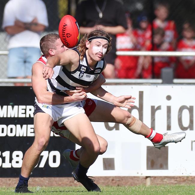 South Bendigo’s Brock Harvey tackles Strathfieldsaye’s Kya Lanfranchi.