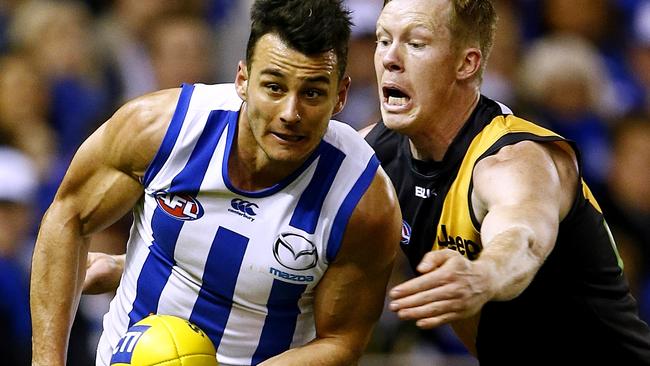 Robbie Tarrant beats Jack Riewoldt to the ball. Picture: Wayne Ludbey