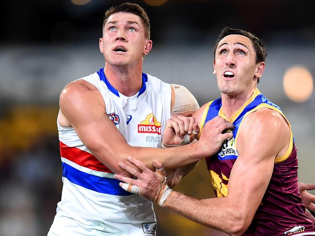 BRISBANE, AUSTRALIA - JUNE 30: Jordon Sweet of the Bulldogs and Oscar McInerney of the Lions compete for the ball during the round 16 AFL match between the Brisbane Lions and the Western Bulldogs at The Gabba on June 30, 2022 in Brisbane, Australia. (Photo by Albert Perez/AFL Photos via Getty Images)