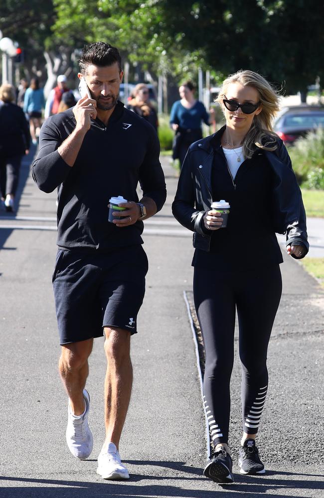 Tim Robards and Anna Heinrich walk in Rose Bay on Sunday after revealing they were expecting their first child on Saturday. Picture: Matrix