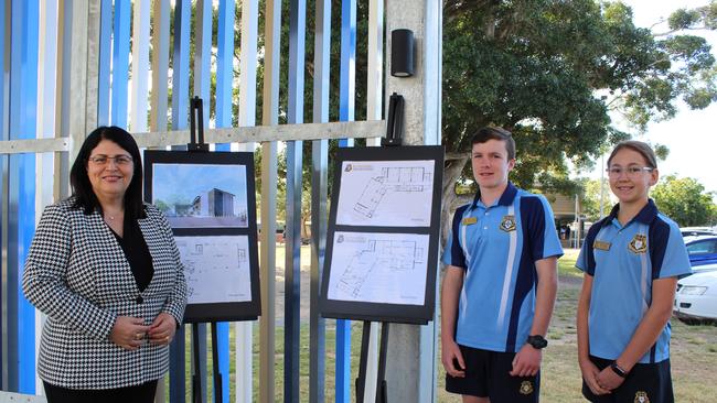 Education Minister Grace Grace and Bundaberg State High School Students Damon Pegg and Tiarna Law look at the plans for the new three-storey learning centre.