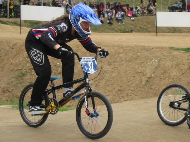 IN THE RACE: Britney Cole on her way to third place in 20 inch class at the ACT BMX Championships