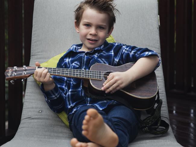 Ollie loves to play the ukulele, following in his dad, The Angels guitarist Chris Bailey’s, footsteps. Picture: Jenny Evans