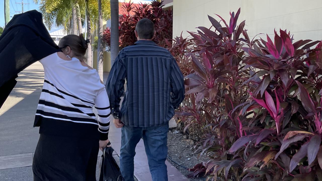 Cindy Lee and James Wallace Tree try to dodge having their photo taken as they leave Mackay courthouse.