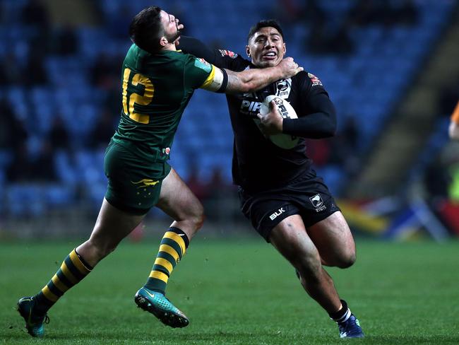 Jason Taumalolo is tackled by Matt Gillett.