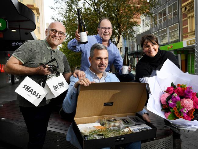 COVID. Dennis Karis owner of Opt Shop Optometry & Shades, George Kasimatis owner of Georges on Waymouth, Michael Andrewartha owner of East End Cellars, Connie Rhigas owner of Adelaide Flower House. Picture: Tricia Watkinson STORY: One in two small businesses in the accomodation, food and retail sectors don't believe they will survive another three months of restrictions, a new survey found. Buisness SA are urging Sout Haustralians to look after 'the little guy' with fears smaller businesses will struggle to survive without significant support even when restrictions are lifted. Picture: Tricia Watkinson