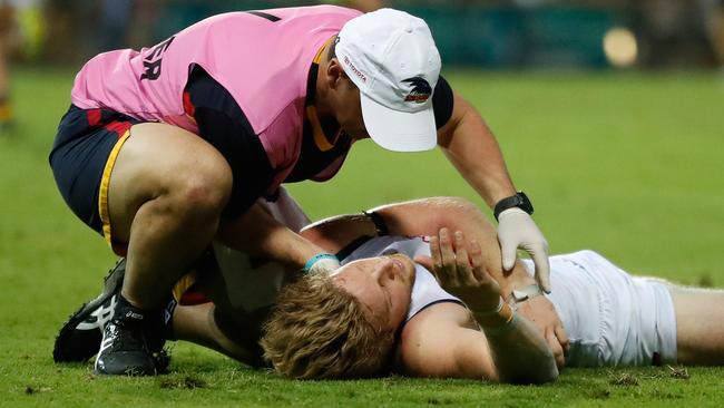 Rory Sloane in the hands of the trainer after he was KO’d. Picture: Getty Images