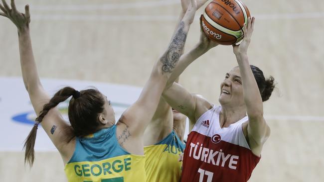 Turkey centre Nevriye Yilmaz (11) shoots over Australia forward Cayla George.