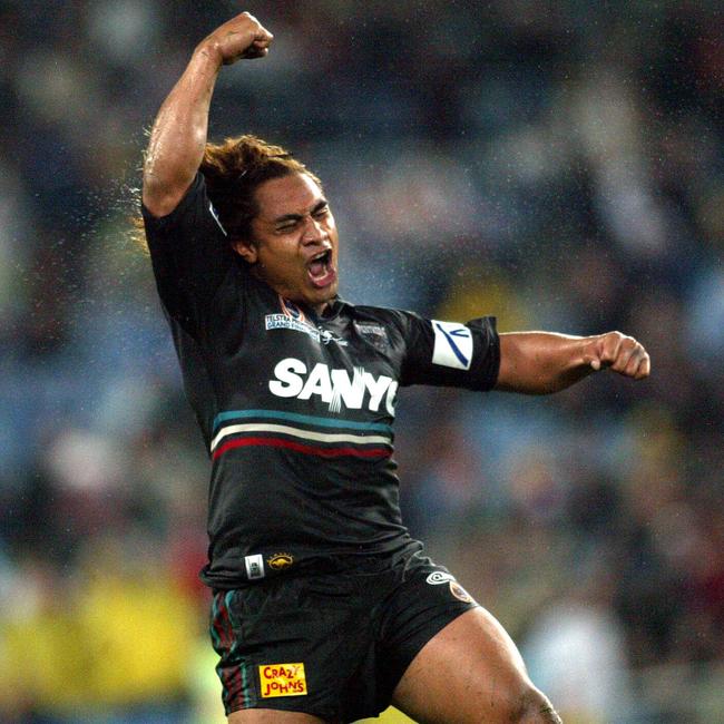 Joe Galuvao celebrates winning the 2003 grand final. Picture: Brett Costello