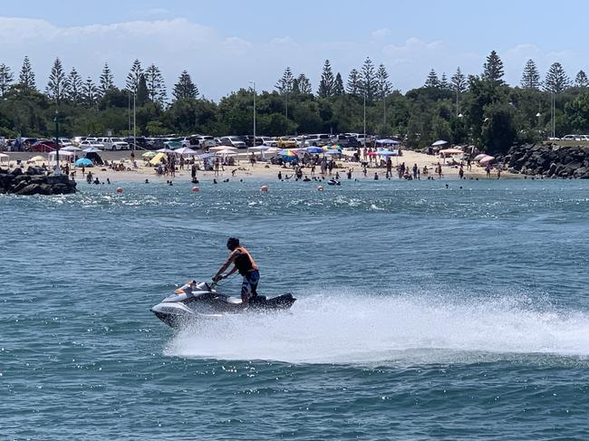 A jet ski coming past the Forster Breakwall with the Tuncurry Rock Pool in the background.  Picture: Janine Watson.