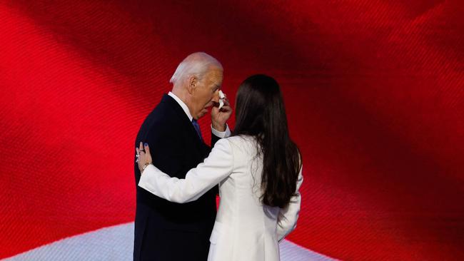 President Joe Biden wipes away a tear as daughter Ashley Biden greets him onstage during the first day of the Democratic National Convention at the United Center in August. Picture: Chip Somodevilla/Getty Images/AFP