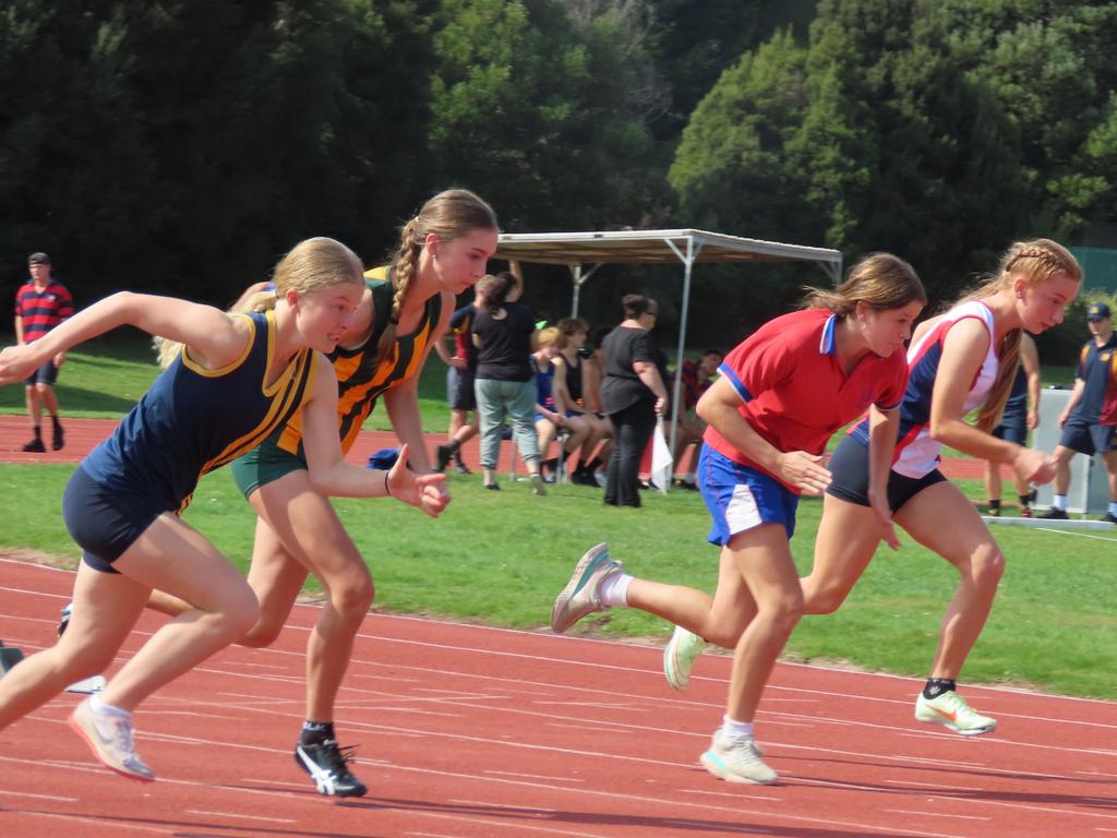 Runners compete in the under-16 girls' 100m. Picture: Jon Tuxworth