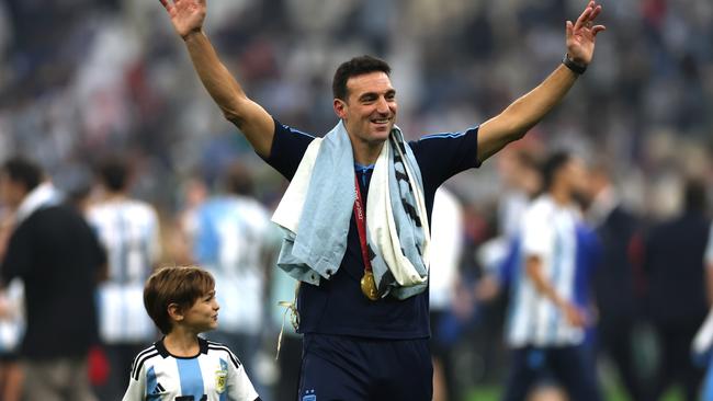 Lionel Scaloni, Head Coach of Argentina, celebrates with his child.