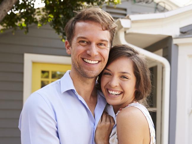 A couple who have just signed up a mortgage after buying their first house. Generic first home buyers Picture: iStock.