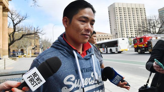 Van Ho Le outside the Magistrates Court in Adelaide after he was fined for smuggling the rare fish into Australia. Picture: AAP / David Mariuz