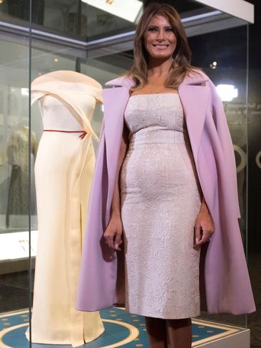 OCTOBER 20: Donating her inaugural ball gown to the Smithsonian, the First Lady paid tribute to its designer, Hervé Pierre, saying they worked together to create a “modern, sleek, light, unique and unexpected look”. She chose a Dolce and Gabbana dress for the presentation, adding a pop of colour with her pink coat and shoes. Picture: AFP