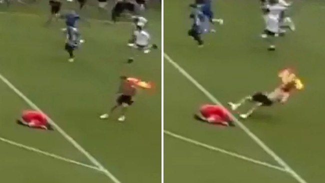 Pitch invader takes out goalie