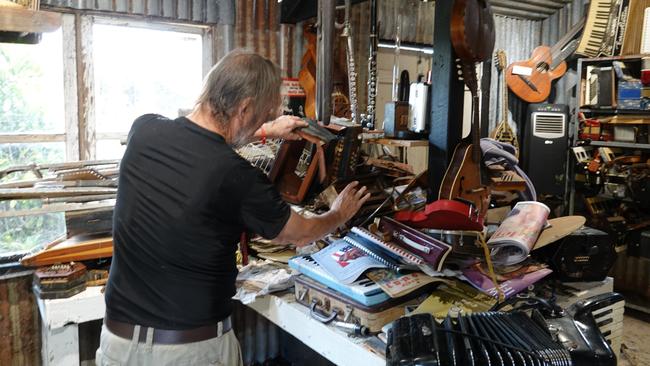 Christiaan Dolislager at his flood-hit musical instrument retail and repair shop at the Old Butter Factory. Picture: Chris Knight