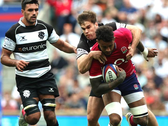 Courtney Lawes, seen here being tackled by Damian Penaud of the Barbarians, is likely to captain England in Australia. Picture: David Rogers/Getty Images