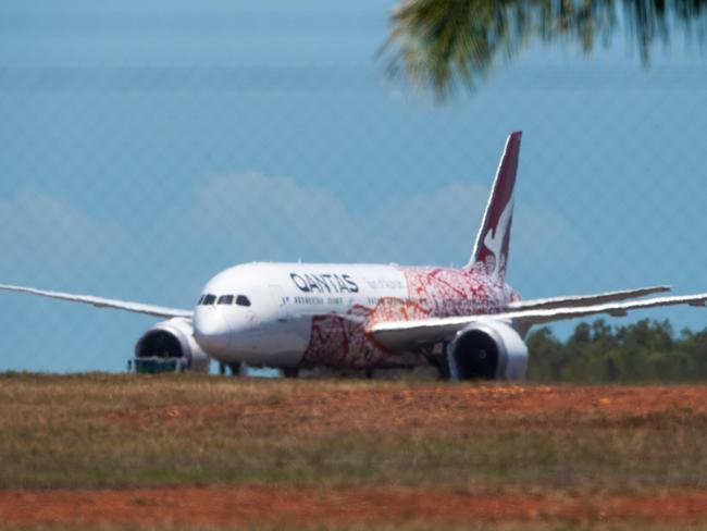 Flight QF110, the first of eight repatriation flights, has touched down in Darwin. Picture: Che Chorley