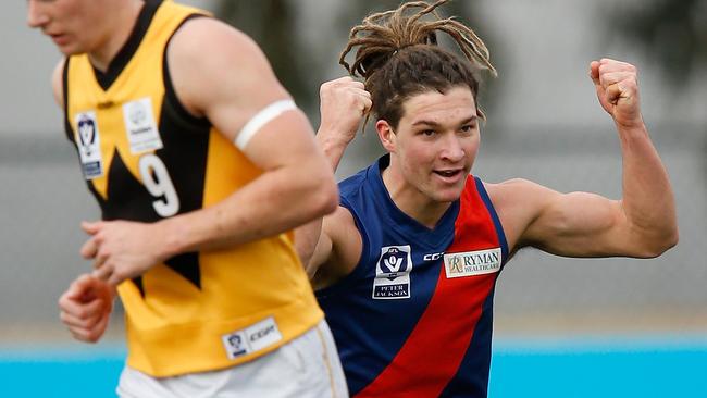 Sam Lowson celebrates a goal for Coburg.