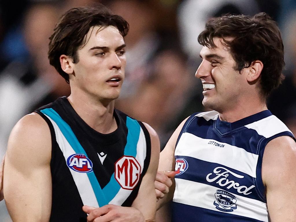 ADELAIDE, AUSTRALIA - SEPTEMBER 05: Shaun Mannagh of the Cats celebrates a goal as Connor Rozee of the Power looks on during the 2024 AFL Second Qualifying Final match between the Port Adelaide Power and the Geelong Cats at Adelaide Oval on September 05, 2024 in Adelaide, Australia. (Photo by Michael Willson/AFL Photos via Getty Images)