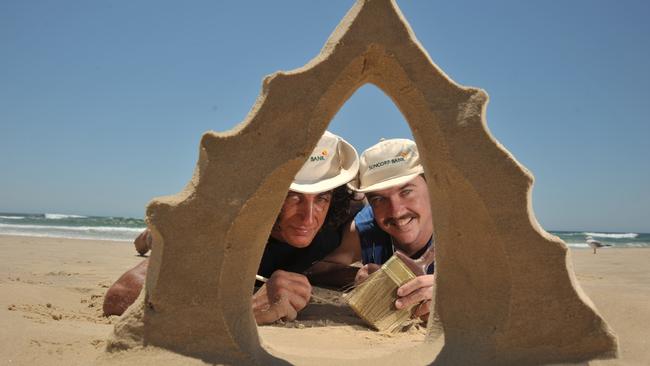 Sand sculptor Dennis Massoud, left, passes on some tips to participant James McDade from Toowoomba in the sand building competition at Coolum Beach in 2009.