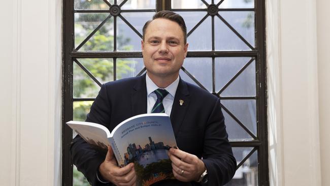 Lord Mayor Adrian Schrinner posing with Budget paper at Brisbane City Hall. Picture: News Corp/Attila Csaszar