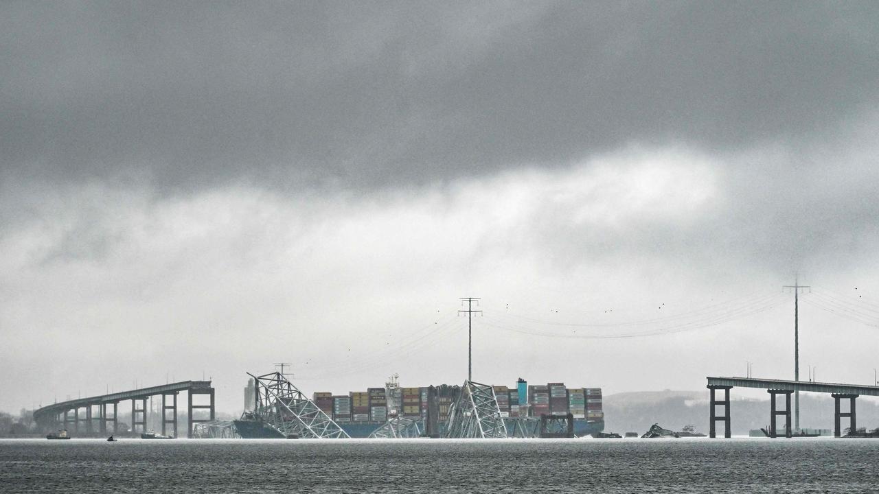 The Dali, a Singaporean-flagged cargo vessel that spans the size of almost three football fields, remains stuck under debris from the Francis Scott Key Bridge. Picture: Roberto Schmidt / AFP