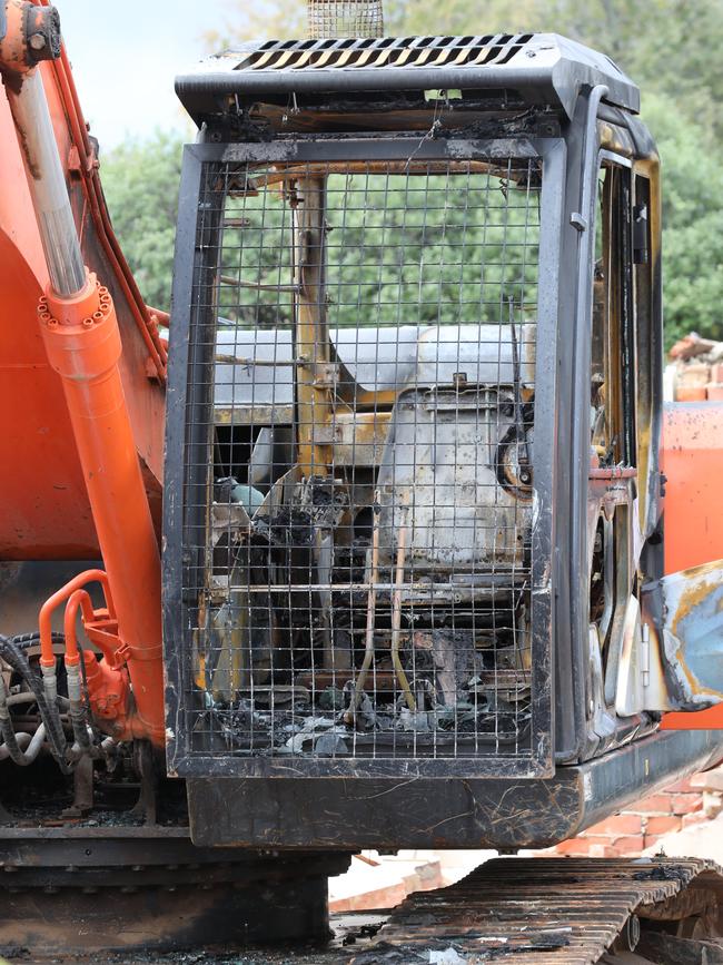 The excavator was set alight and destroyed at a house demolition site in Lockleys in 2023. Picture Dean Martin