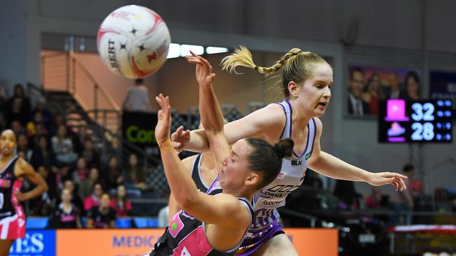 Kelly Altman of the Thunderbirds taken out by Tara Hinchliffe of the Firebirds at Priceline Stadium in Mile End. Picture: Mark Brake/Getty Images