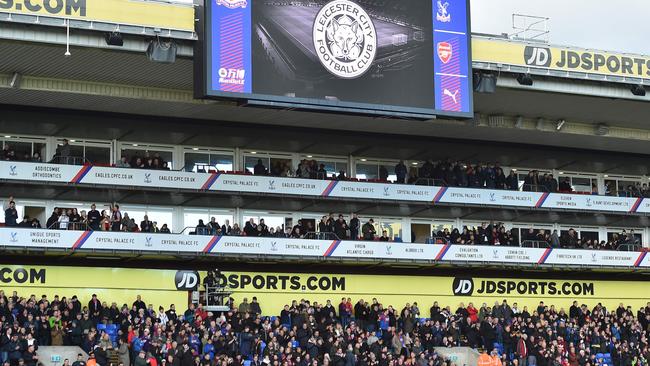 Fans stand for a minute's applause at Selhurst Park in solidarity with Leicester City.