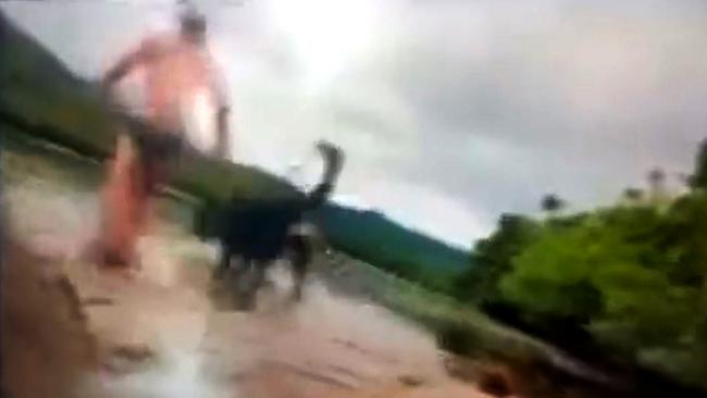 Alister MacPhee and his dog enter the water at the boat ramp.